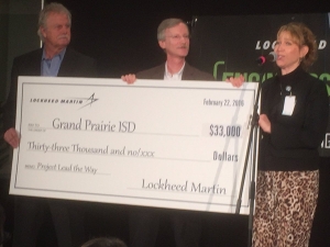 Grand Prairie Mayor Ron Jensen, Lockheed Martin's Gil Metzger and Grand Prairie ISD's Nugget Cunningham at the check presentation to the district.